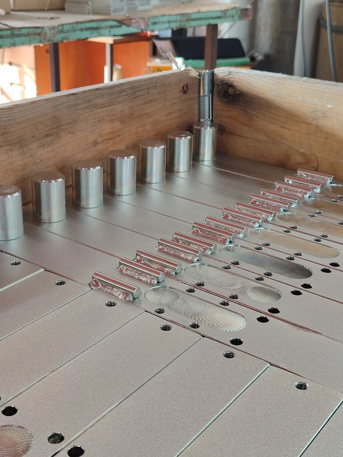 Batch of CNC turned parts on inspection table