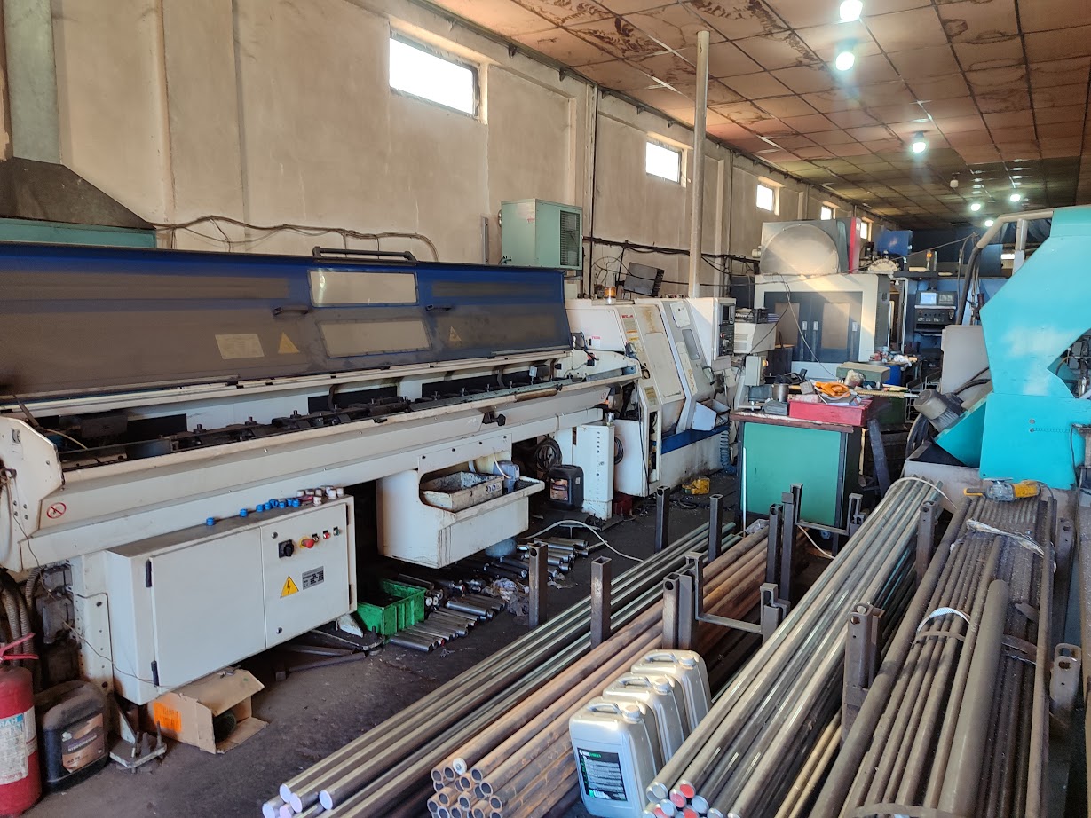 Workshop overview with bar feeders and lathes